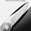 Close-up of VG10 satin drop-point blade featuring high flat grind, precision swedge, and rounded jimping on folding EDC pocket knife.
